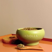 Close-up of premium organic oregano in a rustic handcrafted ceramic bowl